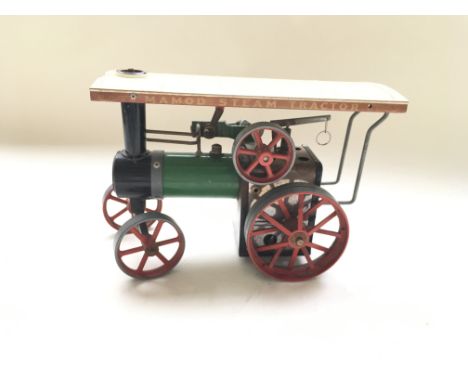 An unboxed Mamod steam engine.