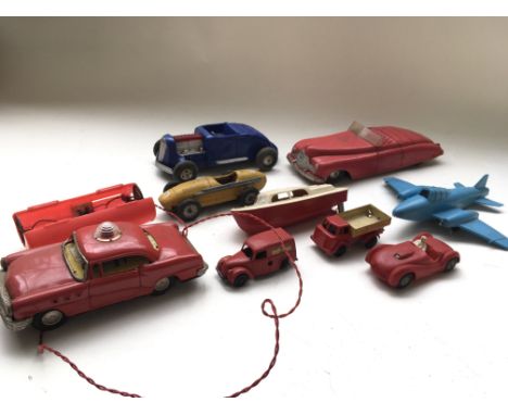 A collection of unboxed play worn tin plate and friction Toys including a Marx sparkling hot rod, a Scalex Maserati, a motor 