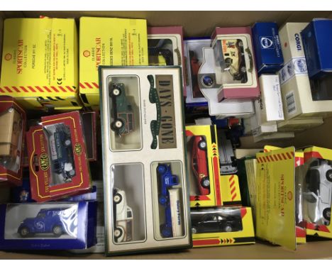 A box of various boxed Corgi and Matchbox model vehicles
