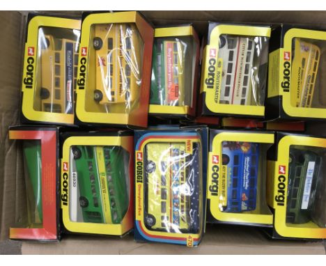 A box containing an extensive collection of 47 boxed Corgi Routemaster buses and others