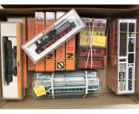 A collection of boxed " N " gauge railway engines, carriages, and goods wagons including Arnold and Fleischmann, together wit