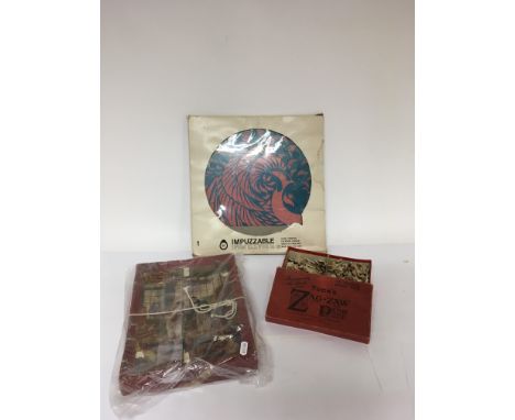 Three vintage jigsaws including a Tuck’s ‘Zag-Zaw’