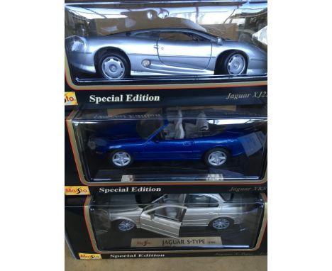 A collection of 5 1/18 scale Maisto model cars including a pink Cadillac Eldorado.