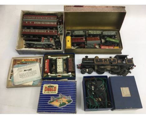 A collection of Hornby "OO" railway items including carriages, goods wagons and Hornby O gauge LNER 4-4-4 engine.