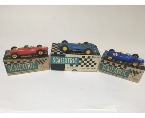 3 boxed and 3 unboxed Scalextric racing cars including early pre braid models with metal bases.