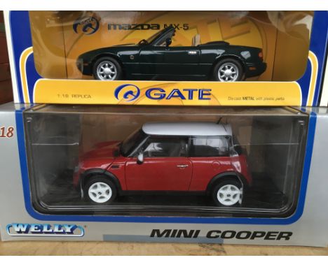 A collection of 4 mint boxed 1/18 scale model vehicles including 2 Guiltoy cars ( Chrysler Atlantic and 1937 BMW 327 coupe ) 