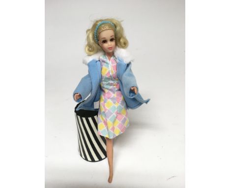 A Francie, vintage ‘American Girl’ Barbie doll, with posable legs, twist waist, blonde hair and applied eyelashes, dressed in