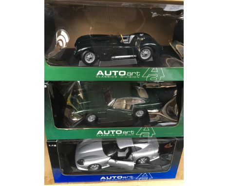 3 boxed Auto art 1/18 scale model vehicles together with a mint boxed Sun Star jaguar xk140.