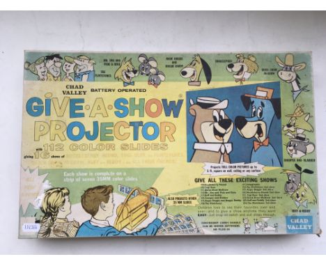 A boxed Chad Valley give a show projector, featuring Huckleberry Hound, Yogi Bear , The Flintstones, etc