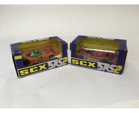 Two Le Mans Scalextric cars, one being a Mazda 787b in very good condition, the other one being a purple Castrol Jaguar XJR14