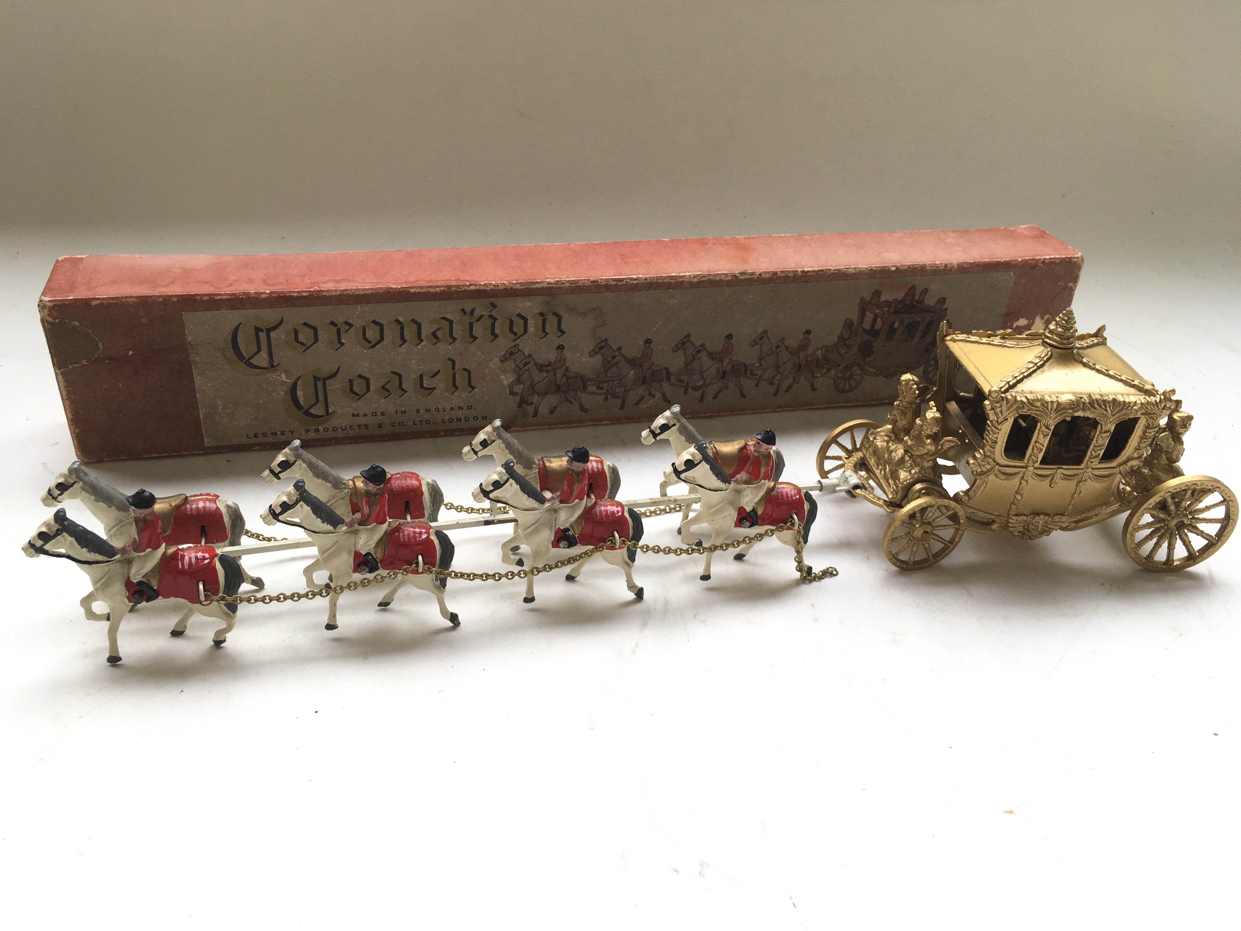 A boxed Matchbox coronation coach, with king and queen inside.