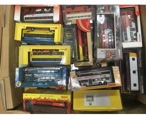 A collection of boxed Corgi buses and coaches.