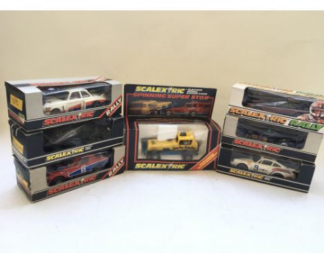 A collection of 7 boxed Scalextric racing cars including a spinning fender bender super stox No C286
