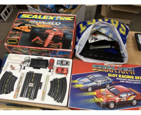 A boxed scalextric Monaco set together with a Sierra XR41 slot racing set along with a bag of track etc.