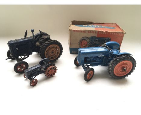 A boxed Chad Valley Fordson Major tractor, together with one inboxed Fordson and one other smaller tractor.