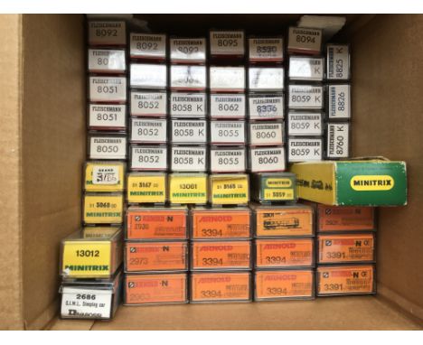A collection of boxed " N " gauge railway carriages including Arnold, Minitrix, Fleischmann etc