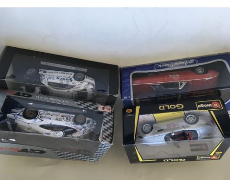 A collection of 4 boxed 1/18 scale model vehicles including Anson, Burago Gold, Maisto GTRacing , and Mercedes Benz Motorspor