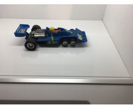 Scalextric spanish Tyrrell 6 wheel, 4054, with original box and paperwork.