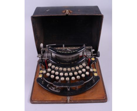 An early 20th century Imperial Model B portable typewriter, in original tin case, numbered 23715Condition: Keys are stiff, we