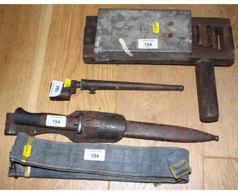 A German WWII bayonet, in leather scabbard, a nail bayonet, in metal scabbard, a belt and an air raid rattleCondition: The Ba