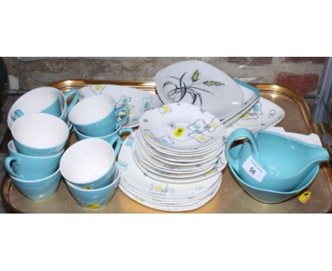 A Midwinter "Cuban Fantasy" tea service, by Jessie Tait, including a dish, two oblong dishes, a television plate, two cups, e