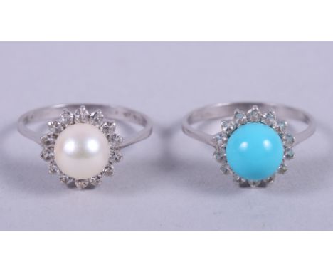 An 18ct white gold turquoise cluster ring, size O, and a similar pearl set cluster ring, size 0, 5.3g gross