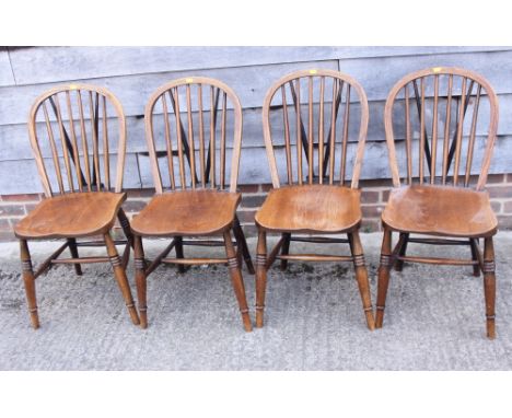 Four Windsor stick back dining chairs, on 'H' stretchered supports