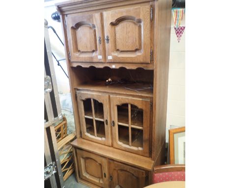 Oak wall unit with two base cupboards two glazed cupboards shelf and two top cupboards 100 x 90 x 210 cm