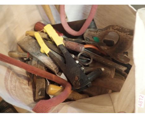 Canvas bag containing hand tools saws screwdrivers hammers files 