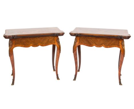 A pair of 19th Century French kingwood, tulipwood, walnut and marquetry, gilt metal mounted card tables:, the baize lined hin