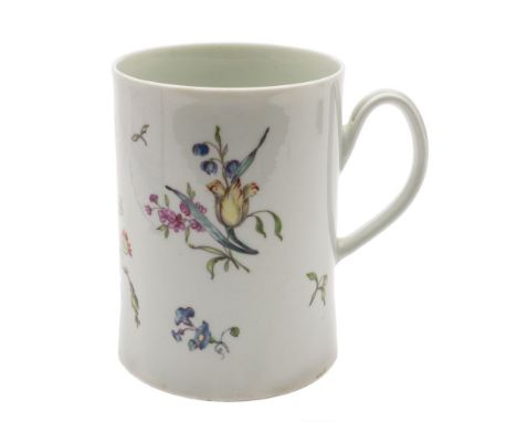 A First Period Worcester mug: of cylindrical form with gently flared base and rim, delicately painted with a large floral bou
