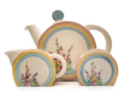 A Clarice Cliff three-piece tea service in the Hollyhocks pattern: of Bonjour shape each painted with blooms within brown, ye