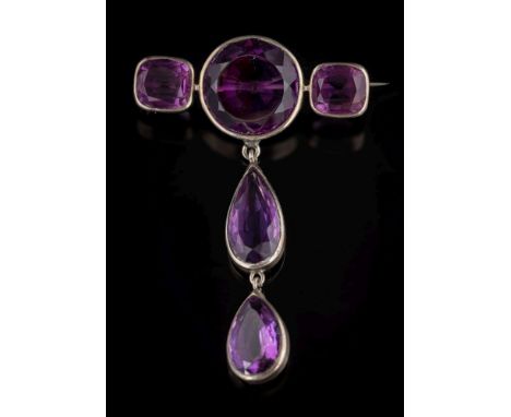 An amethyst mounted brooch: with a bar of one circular and two cushion-shaped stones, suspending two pear-shaped amethyst dro