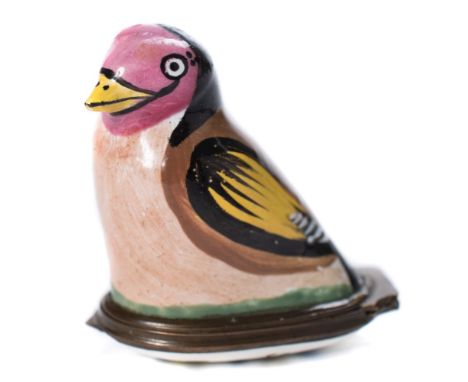 A Bilston enamel bird bonbonniere: in the form of a goldfinch, the hinged lid painted with a flower spray, late 18th century,