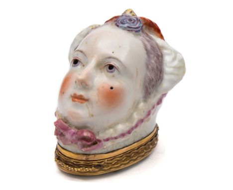 A Chelsea bonbonniere: in the form of a lady's head, wearing a bonnet tied with pink ribbons and a feather plume, the gilt-me