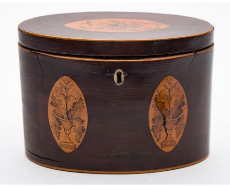 An early 19th century mahogany and inlaid tea caddy: of oval outline, the hinged lid with inlaid floral medallion enclosing t