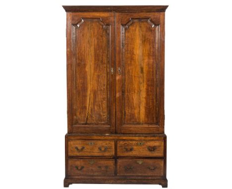 An 18th Century oak and crossbanded hall cupboard:, in two sections, the upper part with a moulded cornice, the interior with