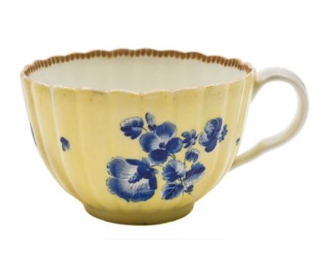 A First Period Worcester tea cup: of reeded form with ear-shaped handle, probably decorated in the workshops of James Giles w
