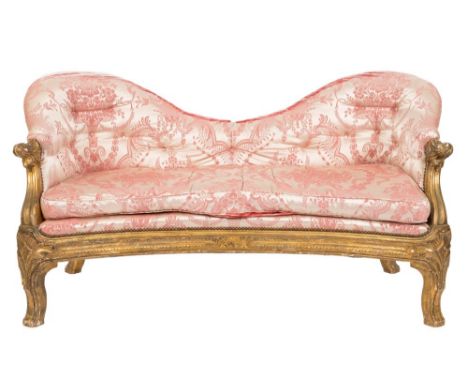 A Victorian carved giltwood settee:, with shaped and upholstered stuff over button down back and concave fronted seat with lo