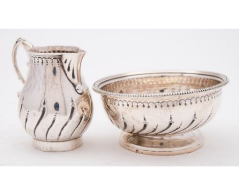 A George III sparrow beak cream jug, maker Samuel Godbehere & Edward Wigan,  London, 1787: of baluster form with writhen flut