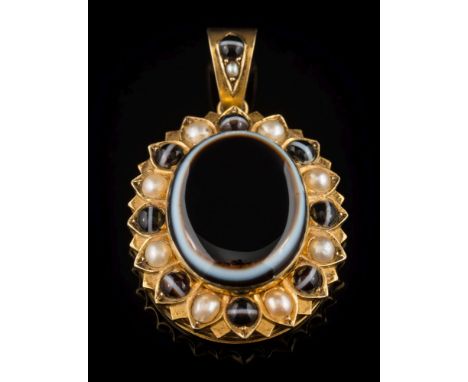A late 19th century gold banded agate and seed pearl oval mourning pendant: with central oval agate within a surround of smal