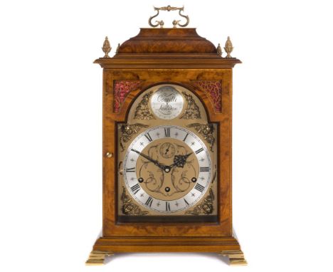 Comitti of London, a Queen Anne-style walnut chiming bracket clock: the eight-day duration movement striking the hours on a b
