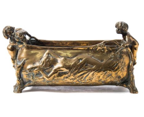 After Charles Korschann (1872-1943) a brass planter: of rectangular outline, decorated  with putti and a female nude figure, 