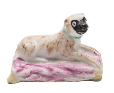 An English porcelain model of a pug dog, attributed to Lowestoft: naturalistically modelled and coloured with brown and grey 