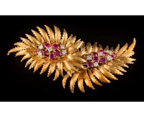 An 18ct gold, ruby and diamond double 'fern' brooch: each 'fern' with a central cluster of circular-cut rubies and diamonds, 