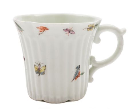 An early Worcester ribbed coffee can: of lobed form and scroll handle, delicately painted with flower sprays, leaves and inse