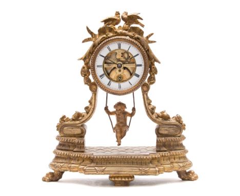 A French mantel clock with an unusual pendulum: the eight-day duration timepiece movement visible through the front and havin