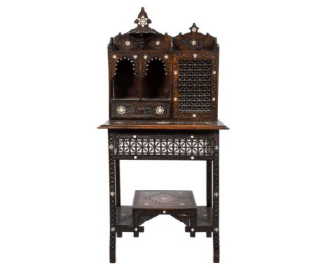 A 19th Century Indian carved wood and inlaid writing cabinet:, with mother of pearl decorated stellar medallions, blind fret 