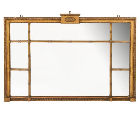A 19th Century giltwood and gesso landscape overmantel mirror:, the panelled mirrored plate within reeded and ribbon tied bor