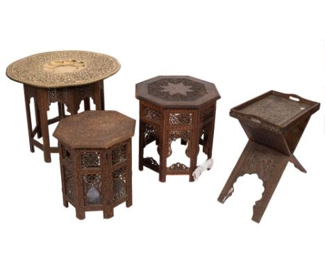 An Indian carved wood and brass inlaid octagonal table:, on a fixed stand, the top decorated with a central flowerhead within